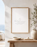 Aegean Stillness minimal line art print — framed wall art mockup showing a minimalist seascape with sun and waves, displayed in a bright Mediterranean-style interior, Morphē Studio

