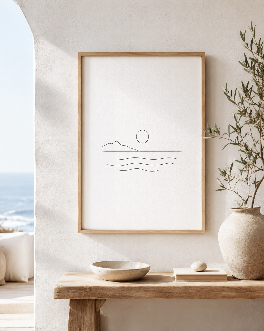 Aegean Stillness minimal line art print — framed wall art mockup showing a minimalist seascape with sun and waves, displayed in a bright Mediterranean-style interior, Morphē Studio

