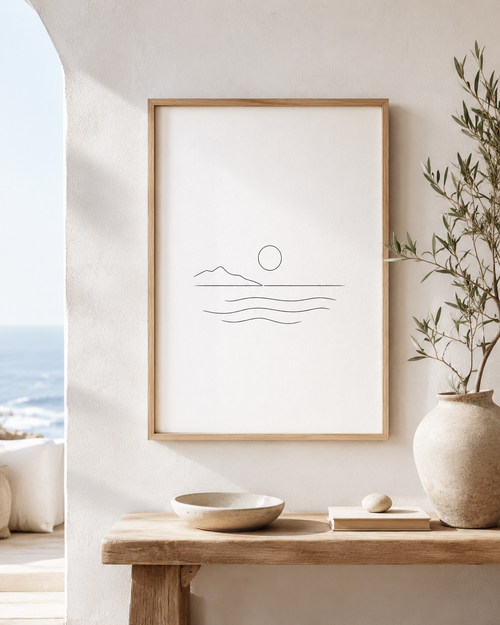 Aegean Stillness minimal line art print — framed wall art mockup showing a minimalist seascape with sun and waves, displayed in a bright Mediterranean-style interior, Morphē Studio

