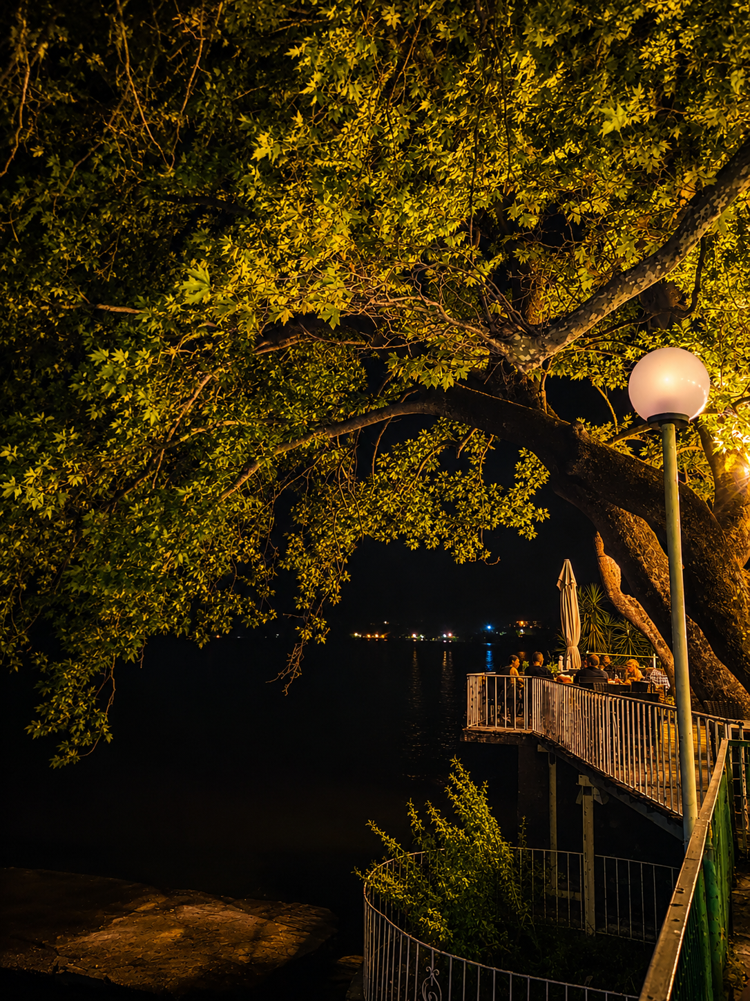 Cinematic lakeside evening at Lake Trichonida Greece – traditional café beneath a plane tree on the shores of Greece's largest natural lake, wall art digital print by Morphē Studio