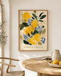 Lemon Grove | Printable Abstract Wall Art | Morphē Studio — framed print on white wall above round wooden dining table with lemons in bowl