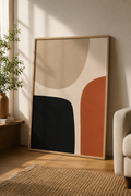 Quiet Balance | Printable Abstract Wall Art | Morphē Studio — large framed organic minimalist print in oak frame leaning on wall beside terracotta vase with olive plant and cream sofa in warm living room